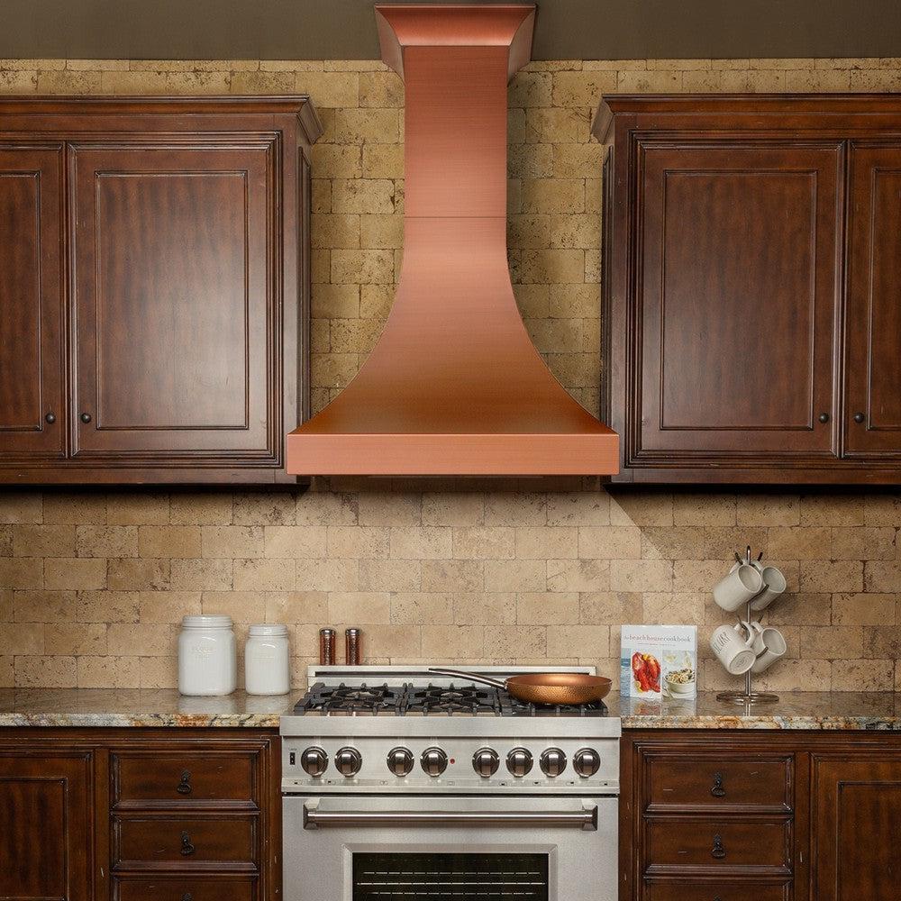 ZLINE Designer Series Copper Finish Wall Range Hood (8632C) in a rustic-style kitchen.