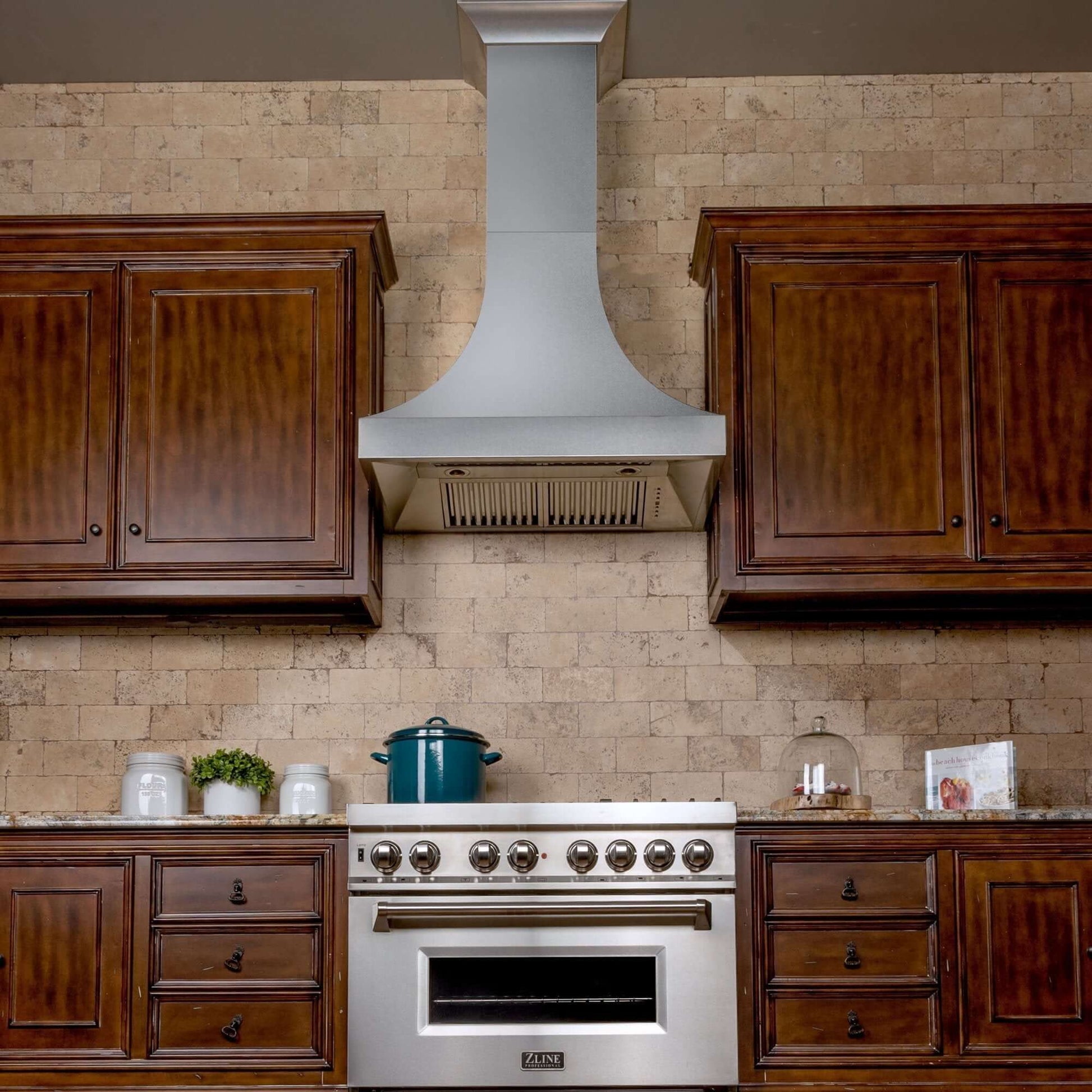 ZLINE Designer Series Fingerprint Resistant Stainless Steel Wall Range Hood (8632S) in a rustic-style kitchen, front under.