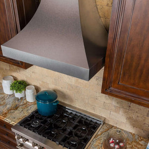 ZLINE Designer Series Fingerprint Resistant Stainless Steel Wall Range Hood (8632S) in a rustic-style kitchen, above.