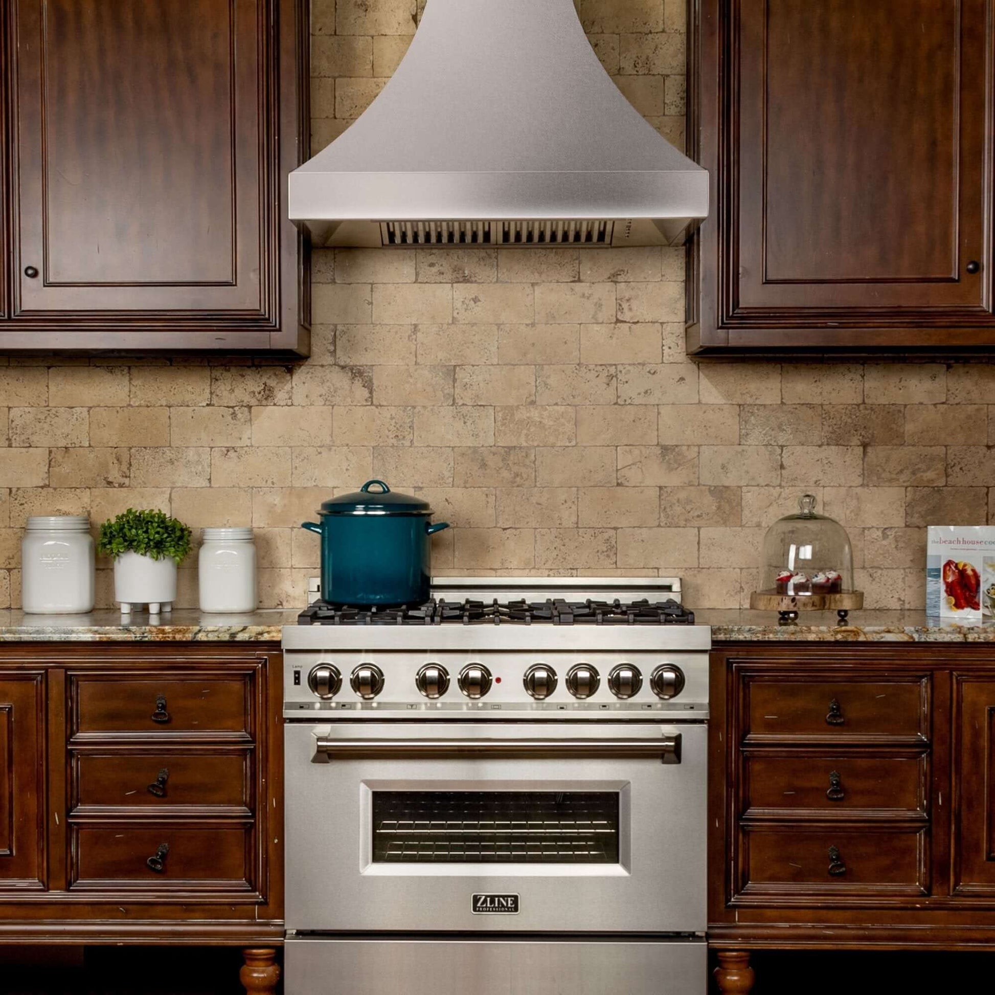 ZLINE Designer Series Fingerprint Resistant Stainless Steel Wall Range Hood (8632S) in a rustic-style kitchen, front.