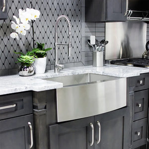 ZLINE Zermatt 30 in. Farmhouse Apron Mount Single Bowl Stainless Steel Kitchen Sink with Bottom Grid (SAS-30) close-up, in a luxury kitchen.