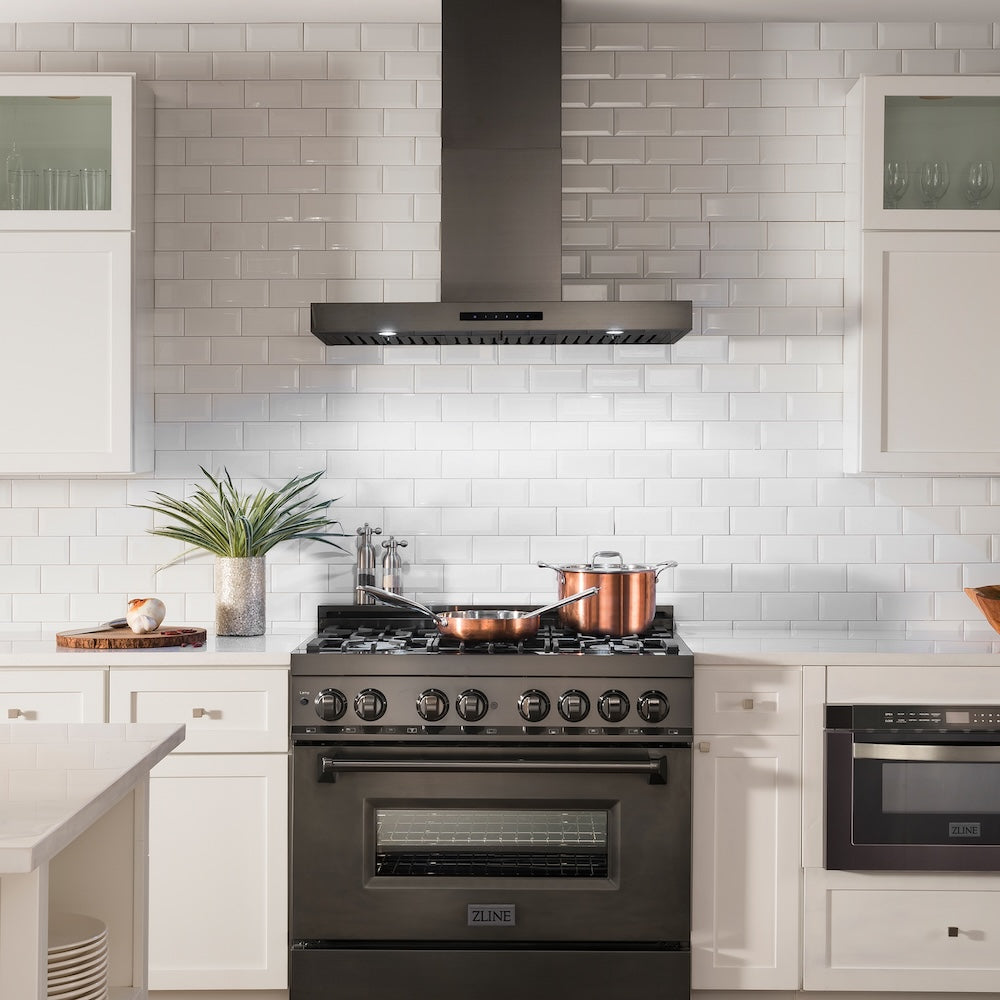Farmhouse kitchen with ZLINE 36 in. Convertible Vent Wall Mount Range Hood in Black Stainless Steel (BSKEN-36) and white tiled walls
