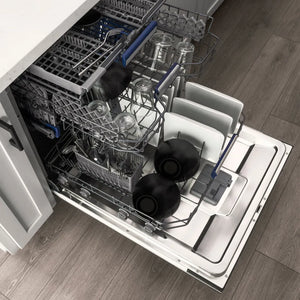Open ZLINE Autograph Edition 24 in. Tallac Series 3rd Rack Dishwasher with Auto Door Open Drying, 51dBa, Stainless Steel Panel with Matte Black Handle (DWVZ-304-24-MB) with dishes inside on a wooden floor