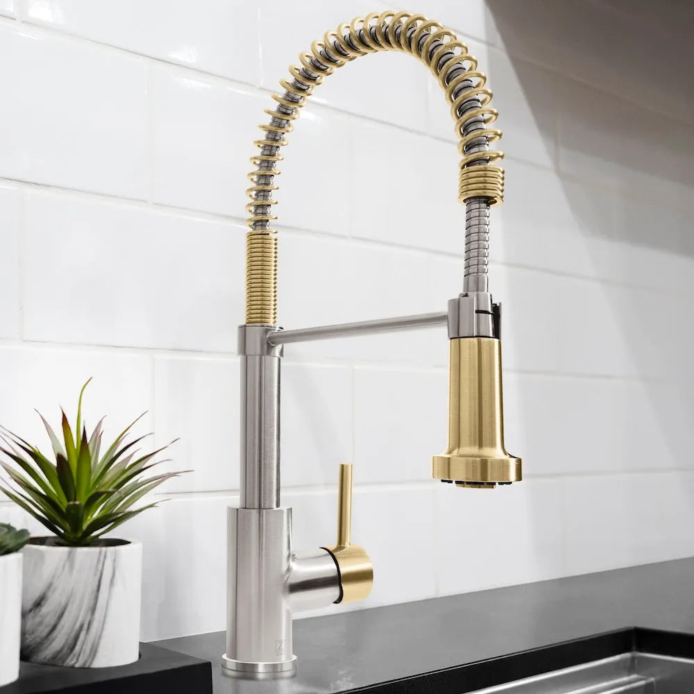 ZLINE Autograph Edition Apollo Pull Down Spring Single Handle Kitchen Faucet in Brushed Nickel and Champagne Bronze (APL-KF-ZBNCB) in a luxury kitchen with a white tiled wall.