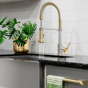 ZLINE Autograph Edition Apollo Pull Down Spring Single Handle Kitchen Faucet in Brushed Nickel and Champagne Bronze (APL-KF-ZBNCB) in a luxury kitchen with black countertop