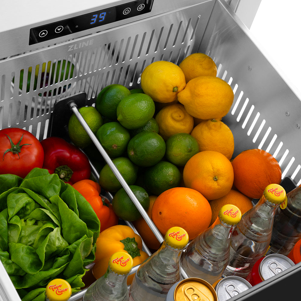 ZLINE Autograph Edition 24 in. Touchstone 168 Can Outdoor-Rated Dual Refrigerator Drawer with Black Stainless Steel Doors and Polished Gold Helix Handles (RDSOZ-BS-24-KG) open refrigeration compartment with fruits, vegetables, and drinks inside