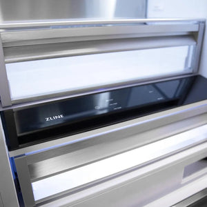 ZLINE Autograph Edition 30 in. 16.1 cu. ft. Built-in 2-Door Bottom Freezer Refrigerator with Internal Water and Ice Dispenser in Black Stainless Steel with Champagne Bronze Accents (RBIVZ-BS-30-CB) close-up, crisper drawer inside refrigeration compartment.