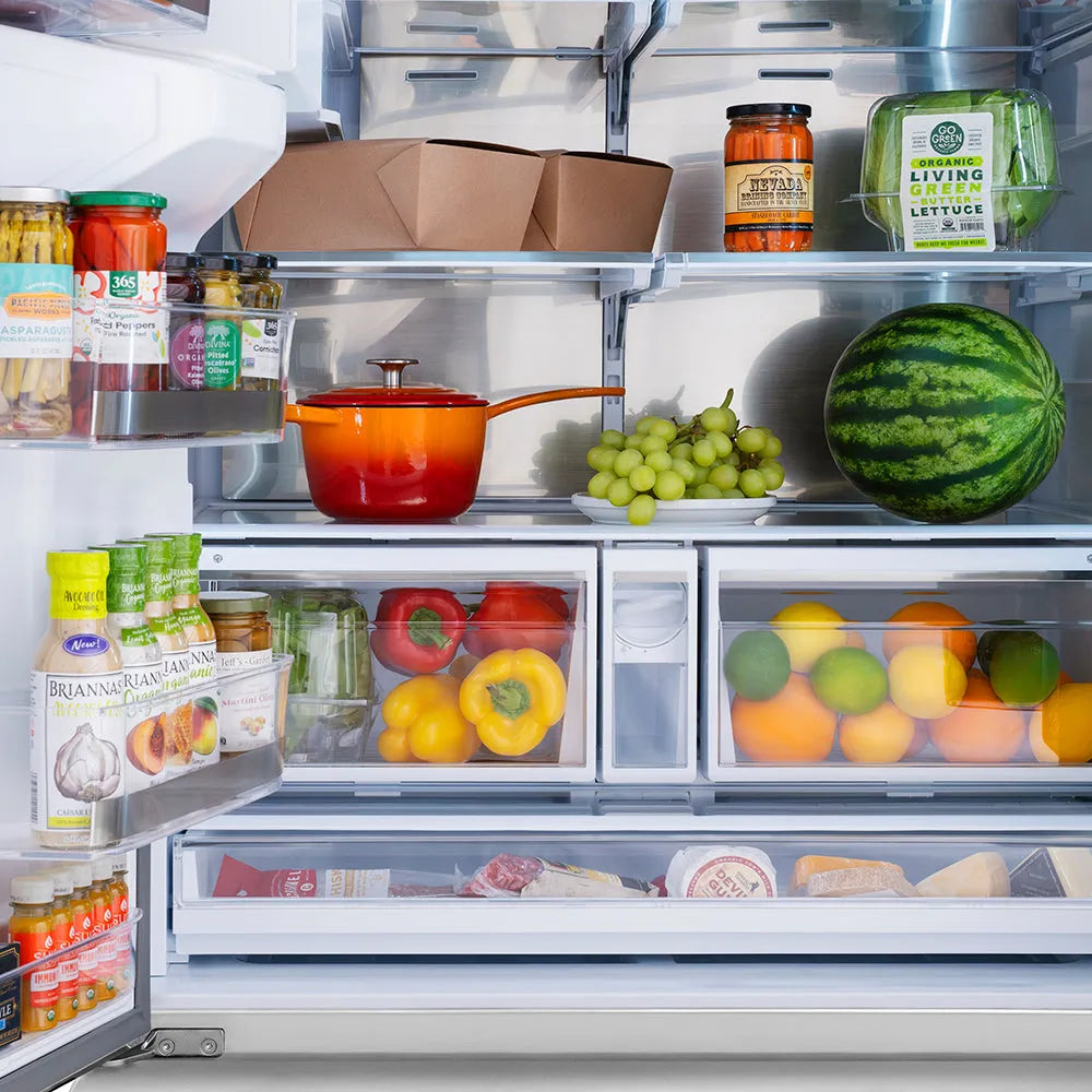 Open ZLINE Autograph Edition 36 in. 28.9 cu. ft. Standard-Depth French Door External Water Dispenser Refrigerator with Dual Ice Maker in Fingerprint-Resistant Stainless Steel and Polished Gold Traditional Handles (RSMZ-W-36-G) with various food items including fruits, vegetables, and a pot.