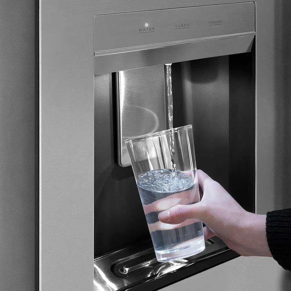 Hand filling a glass with water from a ZLINE Autograph Edition 36 in. 28.9 cu. ft. Standard-Depth French Door External Water Dispenser Refrigerator with Dual Ice Maker in Fingerprint-Resistant Stainless Steel and Polished Gold Traditional Handles (RSMZ-W-36-G)