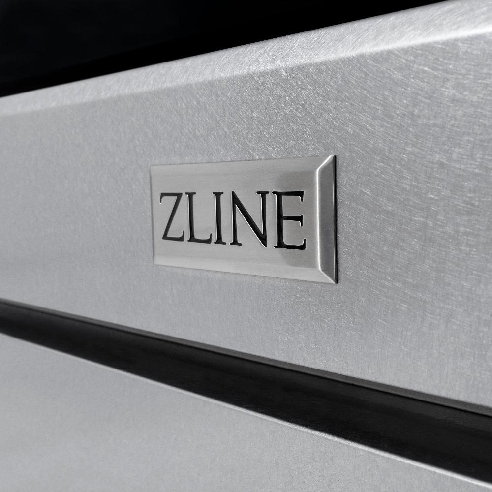 ZLINE Autograph Edition 30 in. 4.2 cu. ft. Paramount Dual Fuel Range with 4 Burner Gas Cooktop and Electric Convection Oven in DuraSnow® Stainless Steel with Champagne Bronze Accents (SDRSZ-30-CB) close-up, logo badge on DuraSnow® Stainless Steel finish.