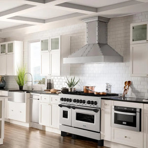 Farmhouse kitchen with white cabinets, ZLINE Autograph Edition 48 in. 6.0 cu. ft. Legacy Dual Fuel Range with 7 Burner Gas Cooktop and 2 Electric Ovens in Satin Stainless Steel and Matte Black Accents (RASZ-SN-48-MB), and a large range hood.