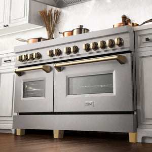 ZLINE Autograph Edition 60 in. 7.4 cu. ft. Legacy Dual Fuel Range with 9 Burner Gas Cooktop and 2 Electric Convection Ovens in Satin Stainless Steel and Polished Gold Accents (RASZ-SN-60-G) below, in a luxury farmhouse-style kitchen.