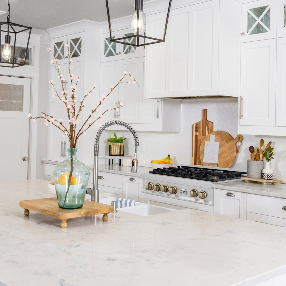 ZLINE Autograph Edition 36 in. Legacy Gas Rangetop with 6 Burners and Porcelain Cooktop in Satin Stainless Steel with Champagne Bronze Accents (RTSZ-36-CB) in a luxury kitchen.