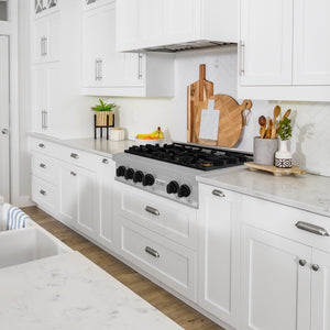 ZLINE Autograph Edition 36 in. Legacy Gas Rangetop with 6 Burners and Porcelain Cooktop in Satin Stainless Steel with Matte Black Accents (RTSZ-36-MB) in a luxury kitchen.