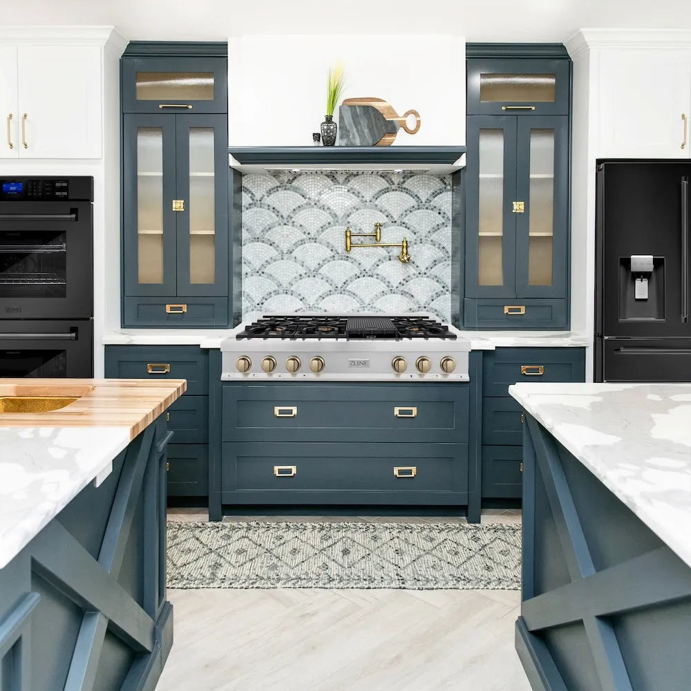 ZLINE Autograph Edition 48 in. Legacy Gas Rangetop with 7 Burners and Porcelain Cooktop in Satin Stainless Steel with Champagne Bronze Accents (RTSZ-48-CB) in a farmhouse kitchen with white cabinets, marble countertops, and decorative elements.