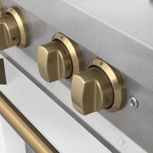 ZLINE Autograph Edition 36 in. 4.6 cu. ft. Legacy Dual Fuel Range with 6 Burner Gas Cooktop and Electric Convection Oven in Satin Stainless Steel with White Matte Door and Champagne Bronze Accents (RASZ-WM-36-CB) knobs.