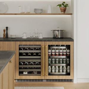 ZLINE Autograph Edition 24 in. Touchstone 151 Can Beverage Fridge With Panel Ready Glass Door And Champagne Bronze Handle (RBSPOZ-24-CB) in a luxury kitchen.