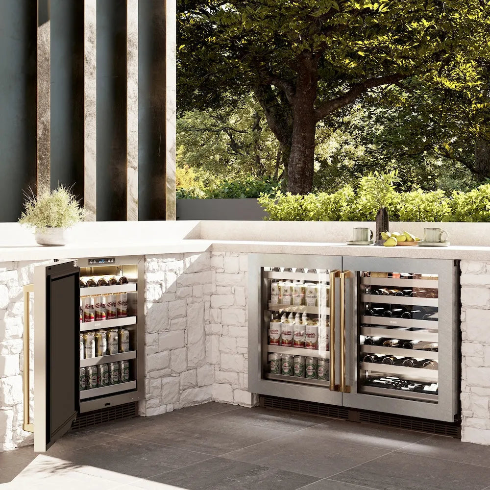 ZLINE Autograph Edition 24 in. Touchstone 151 Can Beverage Fridge With Satin Stainless Steel Glass Door And Polished Gold Handle (RBSOZ-SN-24-G) in a luxury outdoor patio, side.