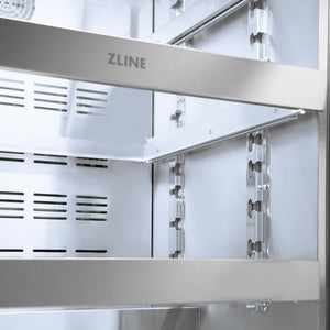 ZLINE Autograph Edition 24 in. Touchstone 151 Can Beverage Fridge With Solid Stainless Steel Door And Champagne Bronze Handle (RBSOZ-ST-24-CB) front, middle full-extension glass racks with ZLINE logo close up.