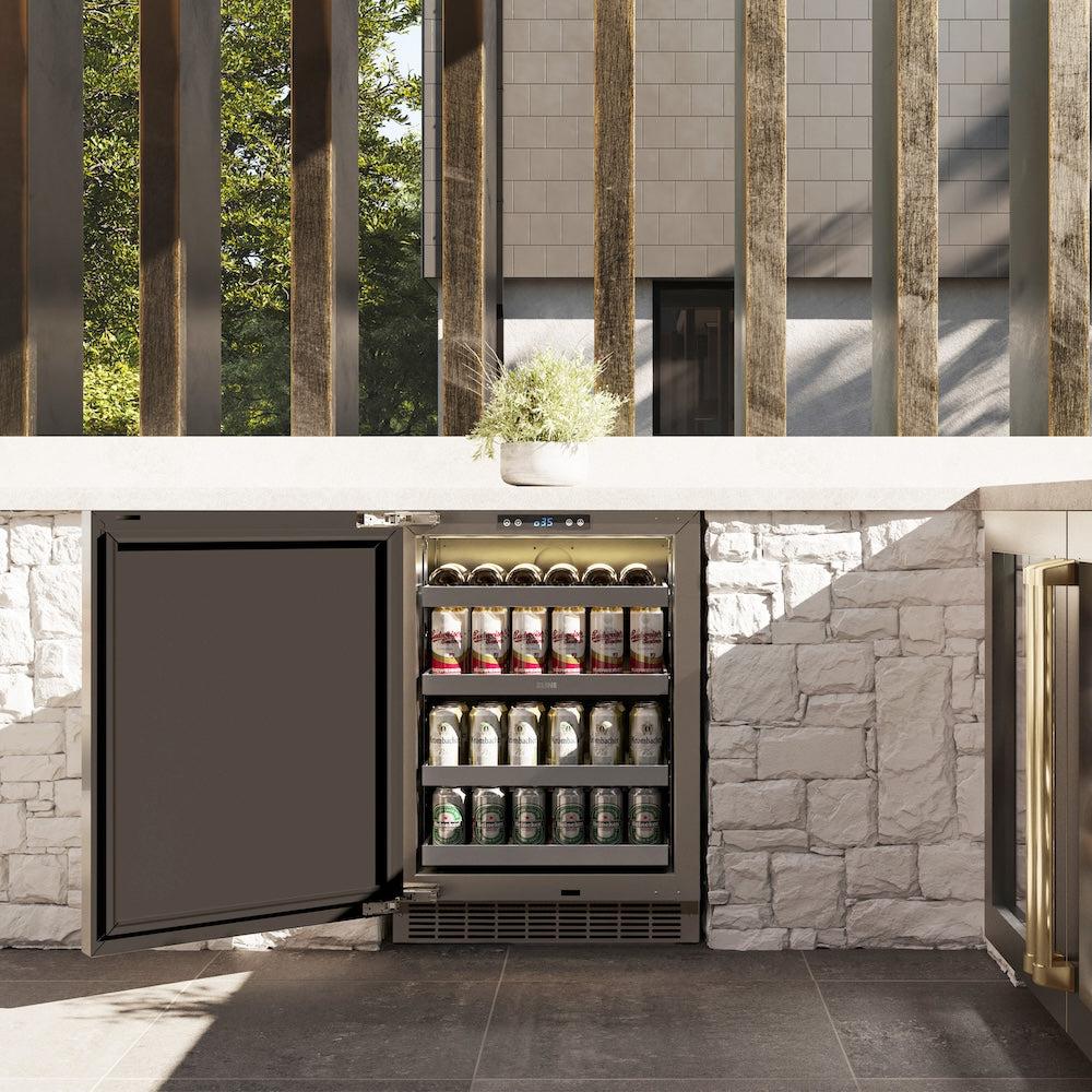 ZLINE Autograph Edition 24 in. Touchstone 151 Can Beverage Fridge With Solid Stainless Steel Door And Champagne Bronze Handle (RBSOZ-ST-24-CB) in a luxury outdoor patio, front, open with bottles and cans inside.