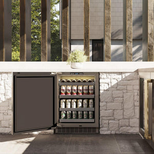 ZLINE Autograph Edition 24 in. Touchstone 151 Can Beverage Fridge With Solid Stainless Steel Door And Champagne Bronze Handle (RBSOZ-ST-24-CB) front, in a luxury outdoor kitchen, open.
