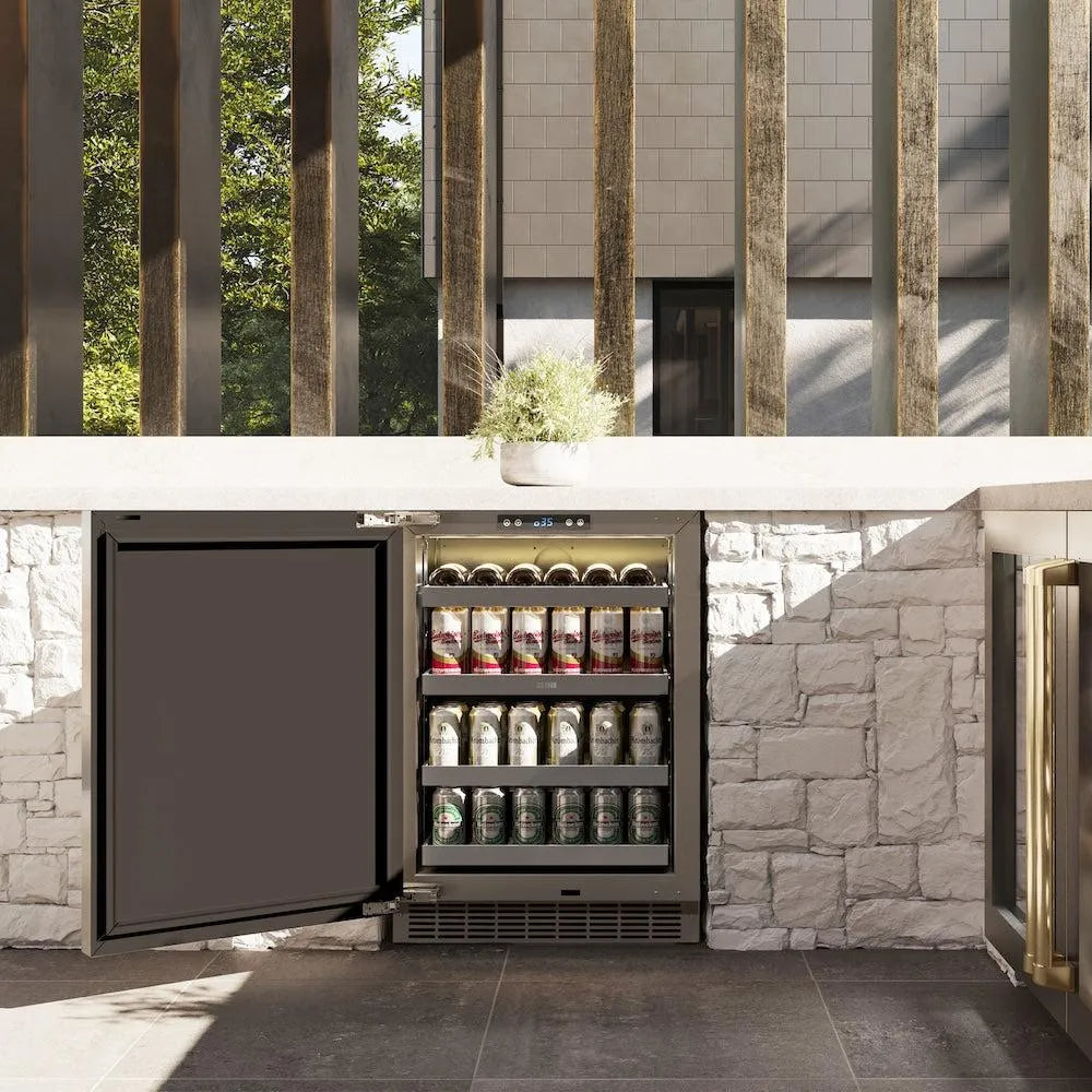 ZLINE Autograph Edition 24 in. Touchstone 151 Can Beverage Fridge With Solid Stainless Steel Door And Champagne Bronze Handle (RBSOZ-ST-24-CB) front, in a luxury outdoor kitchen, open.