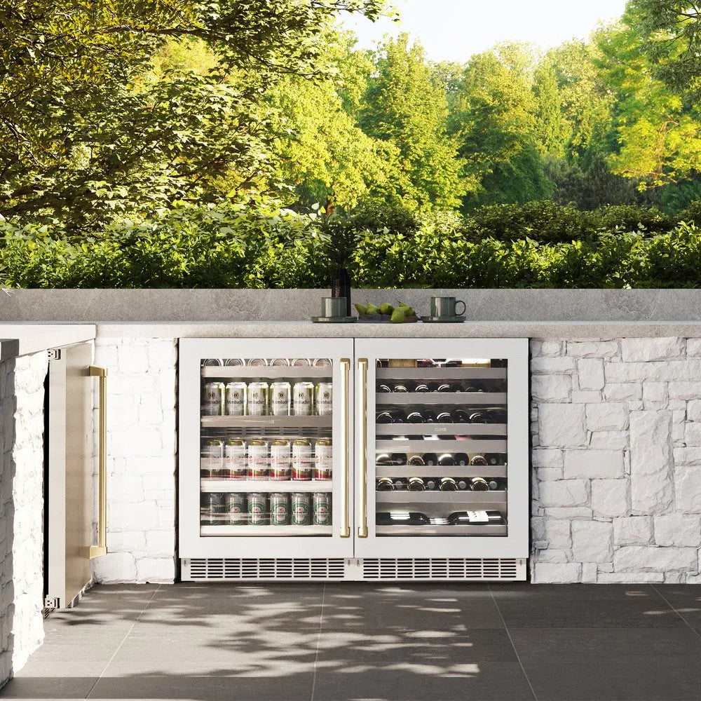 ZLINE Autograph Edition 24 in. Touchstone 151 Can Beverage Fridge With White Matte Glass Door And Champagne Bronze Handle (RBSOZ-WM-24-CB) front, in a luxury outdoor kitchen.
