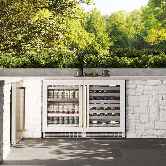 ZLINE Autograph Edition 24 in. Touchstone 151 Can Beverage Fridge With White Matte Glass Door And Polished Gold Handle (RBSOZ-WM-24-G) front, in a luxury outdoor kitchen.