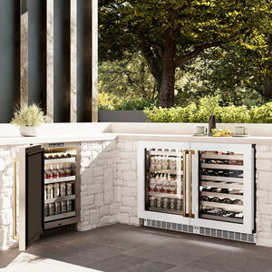 ZLINE Autograph Edition 24 in. Touchstone Dual Zone 44 Bottle Wine Cooler With White Matte Glass Door And Polished Gold Handle (RWDOZ-WM-24-G) side, in an outdoor kitchen with two matching beverage fridges displaying drinks and bottles.
