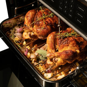 ZLINE Autograph Edition 30 in. Professional True Convection Single Wall Oven with Air Fry and Self Clean in Satin Stainless Steel with Champagne Bronze Helix Handle (WASSZ-30-KCB) oven interior with roasted chickens with herbs, showing the cooking process.