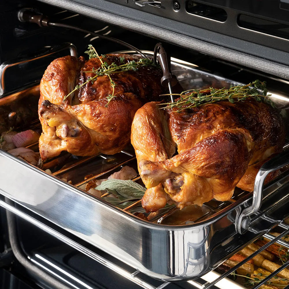 ZLINE Autograph Edition 30 in. Professional True Convection Single Wall Oven with Air Fry and Self Clean in Satin Stainless Steel with Polished Gold Helix Handle (WASSZ-30-KG) oven interior with roasted chickens with herbs, showing the cooking process.