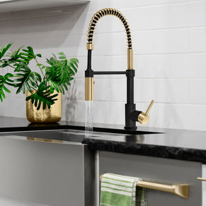 ZLINE Autograph Edition Sierra Pull Down Spring Single Handle Kitchen Faucet in Matte Black and Champagne Bronze (SRA-KF-ZMBCB) in a luxury kitchen, spray on.