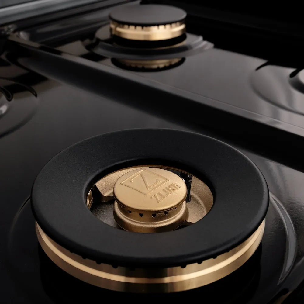 ZLINE Autograph Edition 48 in. 6.0 cu. ft. Legacy Dual Fuel Range with 7 Burner Gas Cooktop and 2 Electric Ovens in Stainless Steel and Polished Gold Accents (RAZ-48-G) close-up, large brass burner.