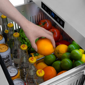 ZLINE Autograph Edition 24 in. Touchstone 168 Can Outdoor-Rated Dual Refrigerator Drawer with Stainless Steel Doors and Polished Gold Handles (RDSOZ-ST-24-G) close-up detail, reaching for an orange in top drawer.