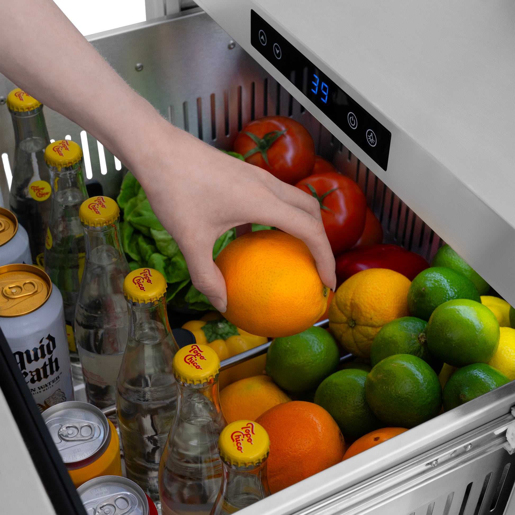 ZLINE Autograph Edition 24 in. Touchstone 168 Can Outdoor-Rated Dual Refrigerator Drawer with Stainless Steel Doors and Matte Black Handles (RDSOZ-ST-24-MB) close-up detail, reaching for an orange in top drawer.