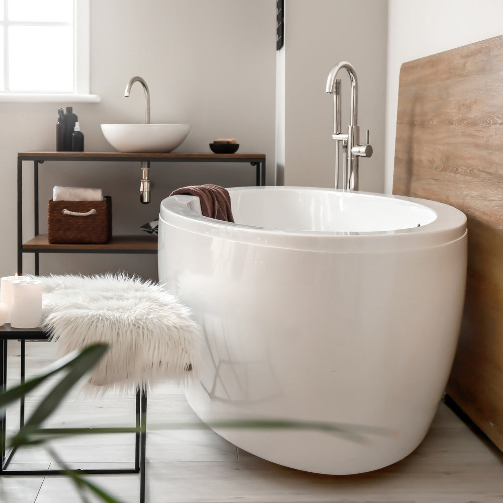 ZLINE Emerald Bay Bath Tub Filler in Brushed Nickel (EMBY-BTF-BN) in a luxury bathroom with large bathtub.