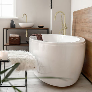 ZLINE Emerald Bay Bath Tub Filler in Champagne Bronze (EMBY-BTF-CB) in a luxury bathroom with large bathtub.