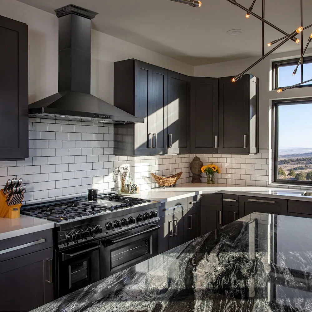 ZLINE 48 in. CrownSound™ Ducted Vent Wall Mount Range Hood in Black Stainless Steel with Built-in Bluetooth Speakers (BSKBNCRN-BT-48) in a luxury kitchen.