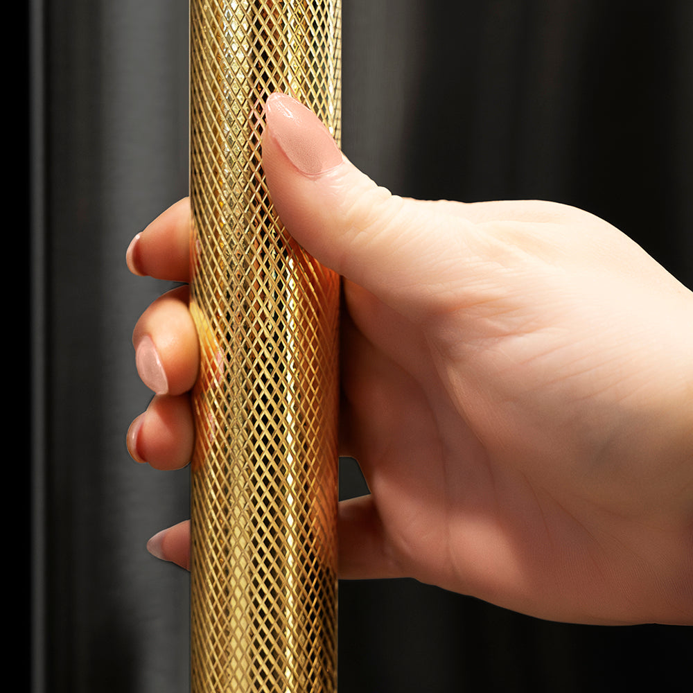 ZLINE Autograph Edition 36 in. 22.5 cu. ft. Counter-Depth French Door Refrigerator with Ice Maker in Fingerprint-Resistant Black Stainless Steel and Polished Gold Helix Handles (RFMZ-36-BS-KG) hand holding Helix handle showing knurled diamond texture.