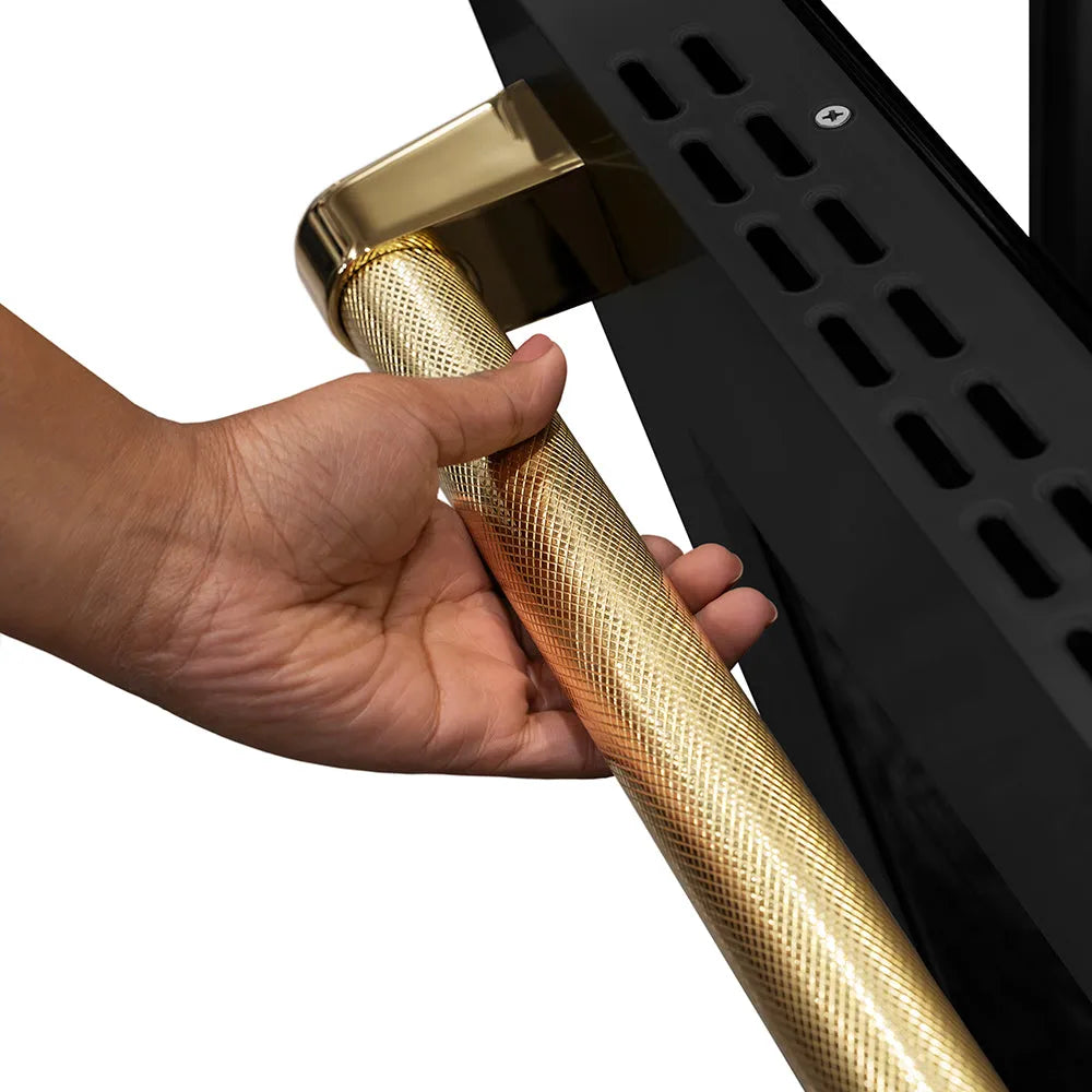 ZLINE Autograph Edition 36 in. 5.2 cu. ft. Paramount Dual Fuel Range with 6 Burner Gas Cooktop and Electric Convection Oven in Black Stainless Steel with Polished Gold Helix Handle and Knob Accents (SDRBZ-36-KG) hand holding Helix handle showing knurled diamond texture.