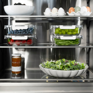 ZLINE Autograph Edition 24 in. 12.5 cu. ft. Panel Ready Column Refrigerator with Graphite Gray Interior and Matte Black Accents (RBCRVZ-24-MB) food on shelves.