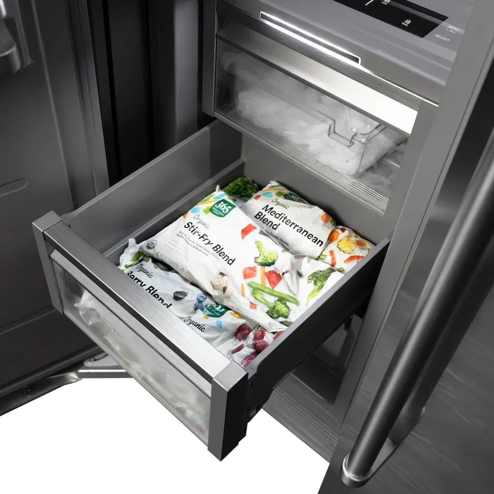 Frozen food packages in drawer inside ZLINE Autograph Edition 24 in. 12.4 cu. ft. Column Freezer in Stainless Steel with Graphite Gray Interior and Polished Gold Accents (RCFVZ-304-24-G).