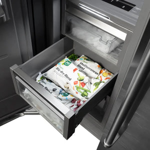 Frozen food packages in drawer inside ZLINE Autograph Edition 24 in. 12.4 cu. ft. Column Freezer in Stainless Steel with Graphite Gray Interior and Polished Gold Accents (RCFVZ-304-24-G).