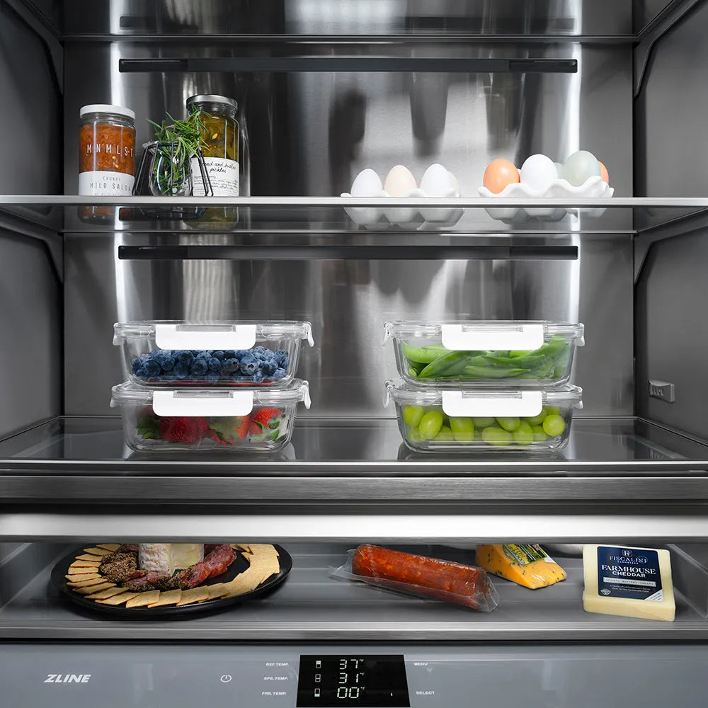 ZLINE Autograph Edition 60 in. 32.2 cu. ft. French Door Built-In Bottom Freezer Refrigerator with Water Dispenser and Ice Maker in Stainless Steel with Graphite Gray Interior and Polished Gold Helix Handles (GRBIVZ-30460KG) spacious interior storage space with food storage containers and fresh produce.