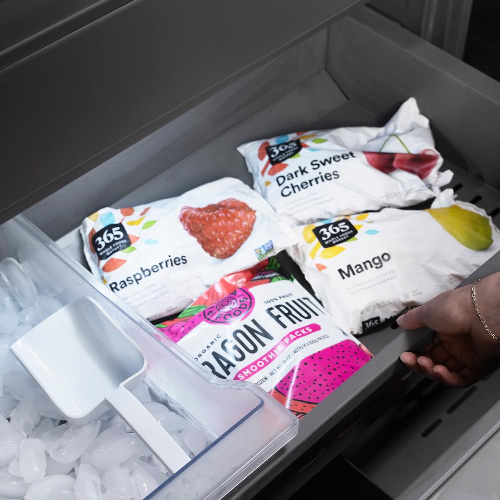 ZLINE 60 in. 32.2 cu. ft. French Door Built-In Bottom Freezer Refrigerator with Water Dispensers and Ice Makers in White Matte with Graphite Gray Interior (GRBIV-WM-60) frozen food inside freezer.