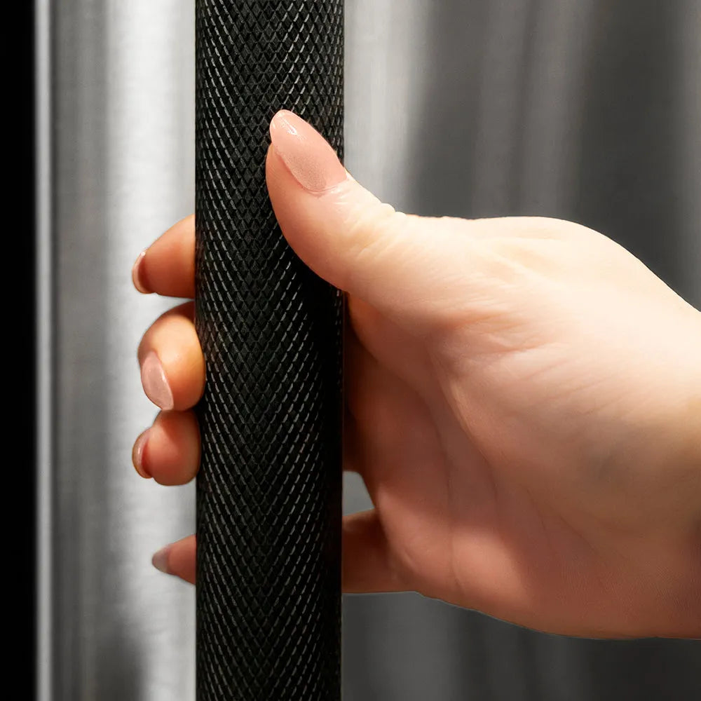 ZLINE Autograph Edition Column Refrigeration Helix Handle (Set of 1) in Matte Black (RCHZ-K-MB) on appliance showing diamond knurled details.
