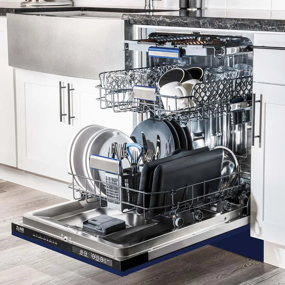 ZLINE 24 in. Tallac Series 3rd Rack Dishwasher with Blue Gloss Panel and Traditional Handle, 51dBa (DWV-BG-24) side, open, in a luxury kitchen with dishes loaded on racks.