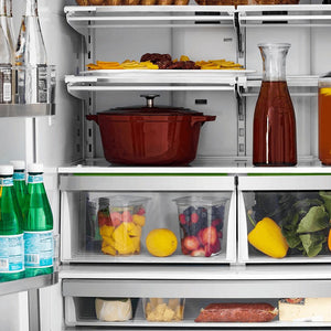 Close-up of food and beverages on adjustable shelving from front inside ZLINE Autograph Edition 36 in. 22.5 cu. ft Freestanding French Door Refrigerator with Ice Maker in Fingerprint Resistant Stainless Steel with Polished Gold Accents (RFMZ-36-G)