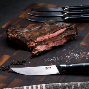 ZLINE 6-Piece Professional German Steel Steak Knife Set (STK-GS-6) on a cutting board with steak.
