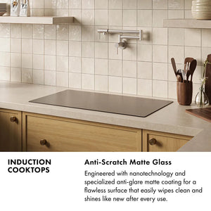 Induction Cooktops Infographic. Image: An induction cooktop set into a light beige countertop. Text: Anti-Scratch Matte Glass. Engineered with nanotechnology and a specialized anti-glare matte coating for a flawless surface that easily wipes clean and shines like new after every use.